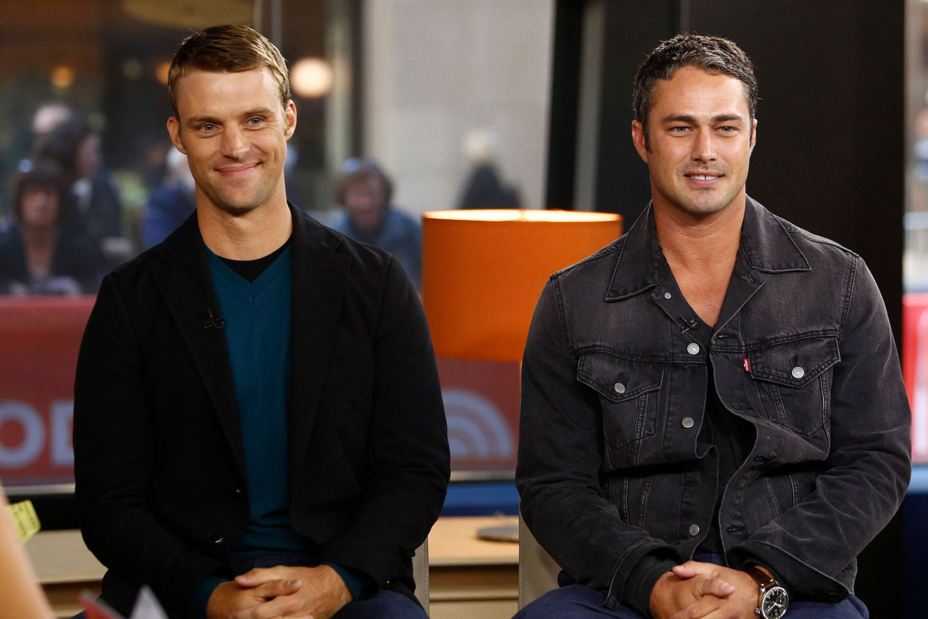 Jesse Spencer and Taylor Kinney sitting together, smiling