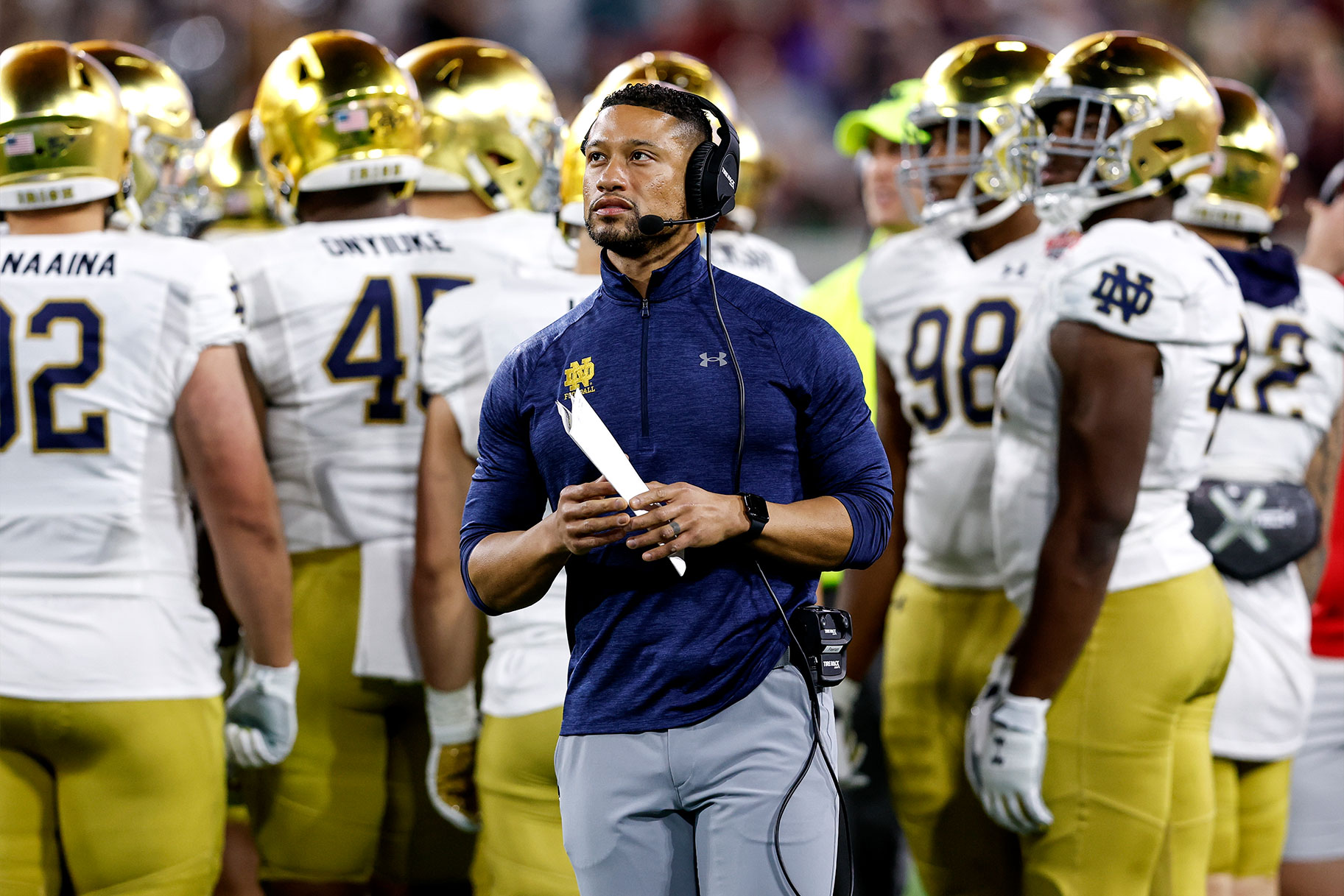 Marcus Freeman stands in front of his team