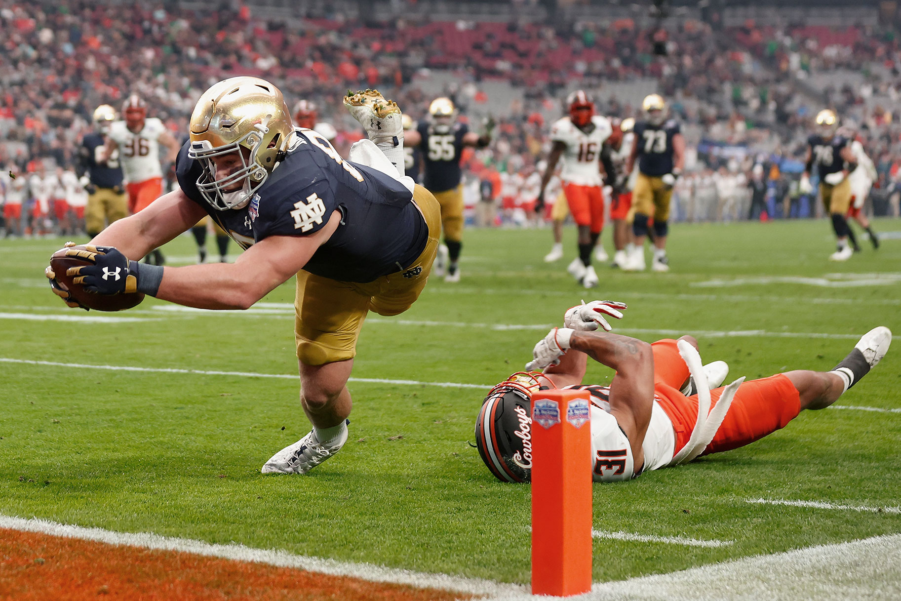 Tight end Michael Mayer dives to score a touchdown