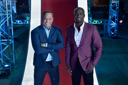 Pictured: (l-r) Matt Iseman, Akbar Gbajabiamila, hosts of American Ninja Warrior