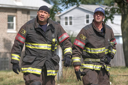 Joe Minoso and Taylor Kinney on Chicago Fire