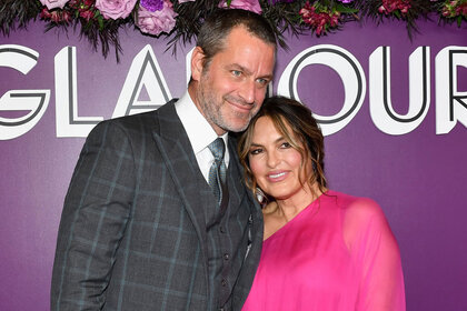 Mariska Hargitay and her Husband embrace on a red carpet