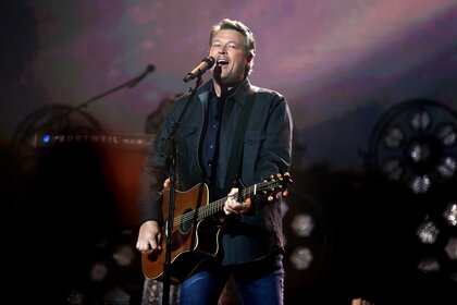 Blake Shelton performing on stage.