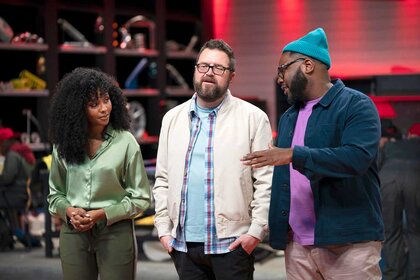 Dalal Elsheikh, Rutledge Wood, and Hertrech Eugene Jr. having a conversation during the Hot Wheels challenge.