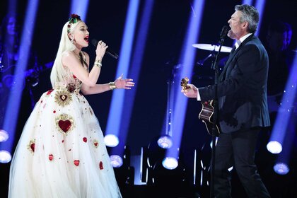 Gwen Stefani and Blake Shelton performing together on stage.