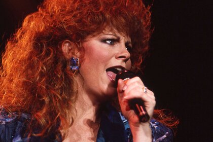 Reba McEntire performing on stage.