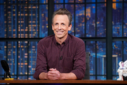 Seth Meyers sits behind his desk while hosting 'Late Night with Seth Meyers'