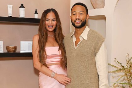 Chrissy Teigen and John Lennon attend an event.