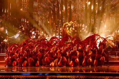 Mayyas performing on stage wearing red outfits during America's Got Talent.