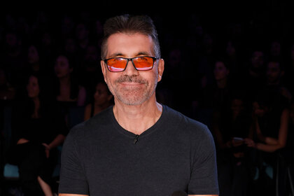 Simon Cowell smiles during the Season 18 AGT finale episode