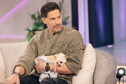 Joe Manganiello on the Kelly Clarkson Show holding his dog Bubbles