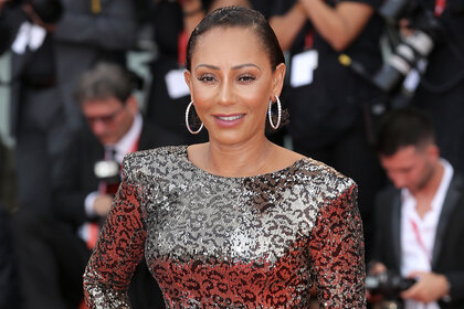 Mel B stands on the red carpet of the Venice Film Festival wearing a sequin leopard dress