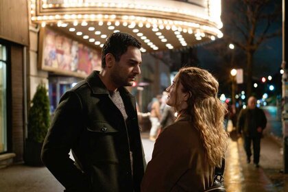 Bashir Hamed and Magalie Leblanc talking outside a theater from a scene in Transplant.