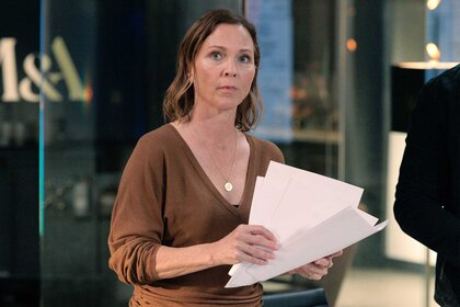 Margaret Reed holding papers in Episode 103 of Found