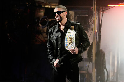 Bad Bunny holds a wrestling belt for Saturday Night Live promos