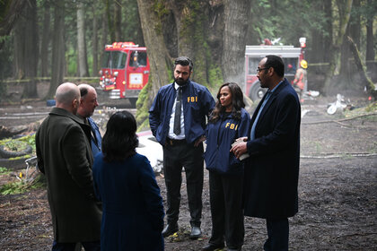 Jace Richards, Marisa, and Alec Mercer standing together outdoors talking to another group of people.