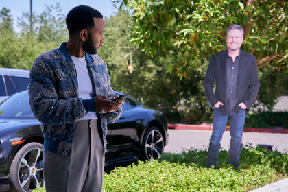 John Legend with a cutout of Blake Shelton on The Voice 2404