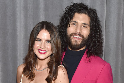 Dan and Abby Smyers pose and smile together at the Grammy's