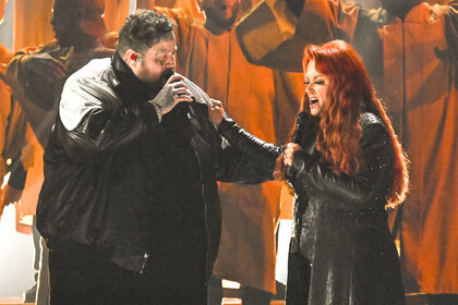 Jelly Roll and Wynonna Judd perform together on stage at the cma's