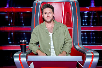 Niall Horan sits at his coaches chair on The Voice Episode 2418