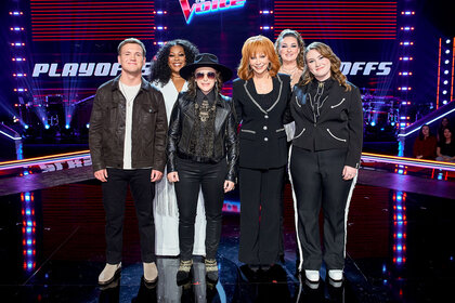 Reba McEntire's team stands on stage during The Voice Episode 2418