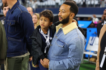 John Legend and his son Miles Stephenson watch the Dallas Cowboys Game