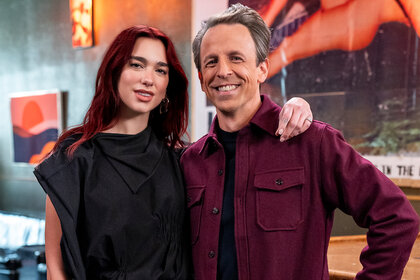 Dua Lipa and Seth Meyers pose together on Late night With Seth Meyers