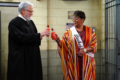 Dan Fielding (John Larroquette) and Roz (Marsha Warfield) make a toast