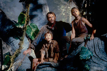 Sam Neill as Dr. Alan Grant, with Ariana Richards (left) and Joseph Mazzello (right) as Lex and Tim, in a scene from the film 'Jurassic Park'