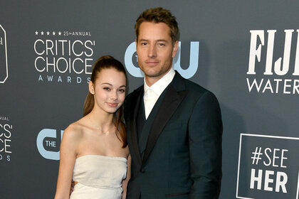 Justin Hartley and his daughter Isabella Justice Hartley pose together on the red carpet of the critics choice awards