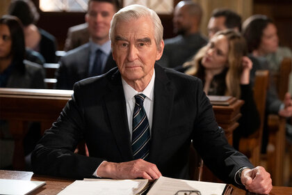 DA Jack McCoy sits at a desk in court on Law and Order Episode 2305