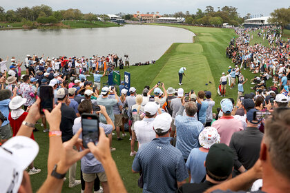 Scottie Scheffler plays his shot at the 18th tee during the final round of the players championship