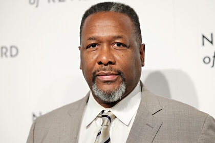 Wendell Pierce wears a grey suit on the red carpet for the 2024 National Board of Review Gala