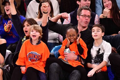 Mariska Hargitay and Peter Hermann attend a basketball game with their children.