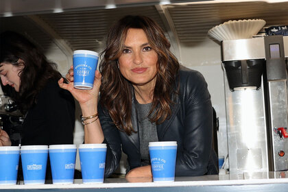 Mariska Hargitay holds up a 'Benson and Co.' coffee cup