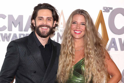 Thomas Rhett and Lauren Akins pose together at the CMAs.