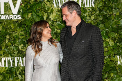 Mariska Hargitay and Peter Hermann look at each other on the red carpet