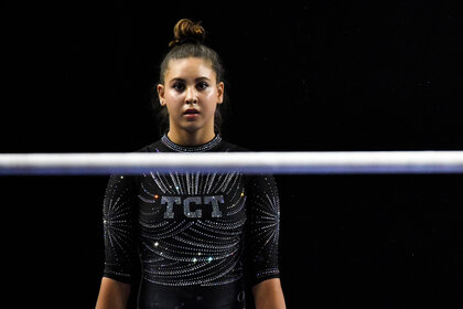 Levi Jung-Ruivivar approaches the Uneven Bars.