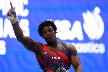 Fred Richard points a finger up at the 2024 U.S. Olympic Gymnastics Trials.