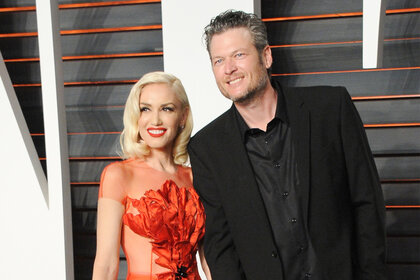 Gwen Stefani and Blake Shelton walk together at the 2016 Vanity Fair Oscar Party