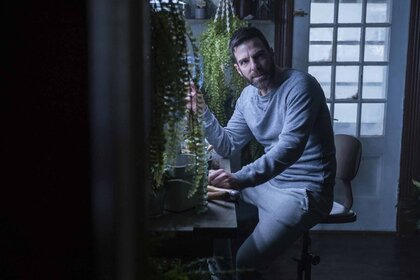 Dr. Oliver Wolf (Zachary Quinto) tends to plants in Episode 101