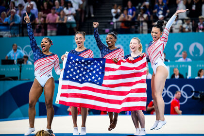 Jade Carey, Sunisa Lee, Simone Biles, Jordan Chiles and Hezly Rivera of Team United States celebrate winning the gold medal