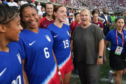 United States head coach Emma Hayes talks with players prior to playing Costa Rica