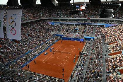 The crowd watches tennis at Roland-Garros at the 2024 Olympics