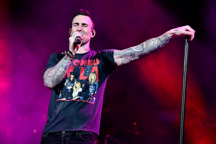 Adam Levine with Maroon 5 performs onstage