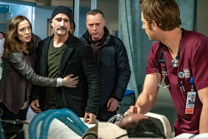 Marina Squerciati as Kim Burgess, Elias Koteas as Alvin Olinsky, Jason Beghe as Hank Voight, and Nick Gehlfuss as Will Halstead in Chicago Fire Season 5 Episode 16.