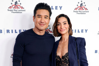 Mario Lopez wears a black sweater with his wife Courtney Mazza