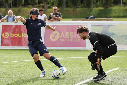 France's forward Frederic Villeroux (L) dribbles past France's goalkeeper Alessandro Bartolomucci during a public training session