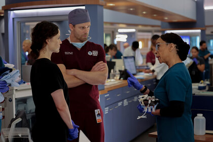 Dr Caitlin Lenox and Dr. Mitch Ripley listen to Sharon Goodwin on Chicago Med Season 10 Episode 1