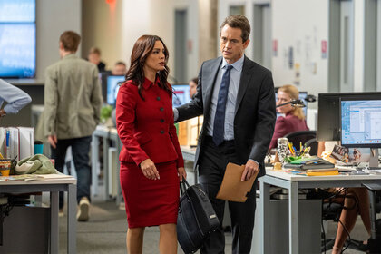 Assistant District Attorney Samantha Maroun (Odelya Halevi), and Assistant District Attorney Nolan Price (Hugh Dancy) speak while standing in the office